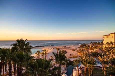 Golden hour over the resort corridor and beach in Los Cabos