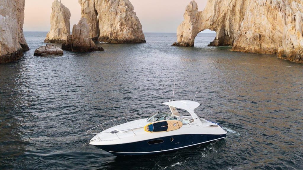 El Arco, the rock arch at Land's End in Cabo San Lucas, with a small boat passing in front of it
