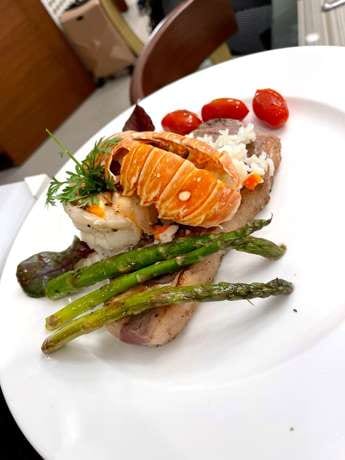 A plated lobster course from a private chef dinner in a Los Cabos villa